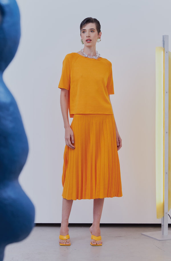 Saia Midi Com Pala Em Tricot Plissado